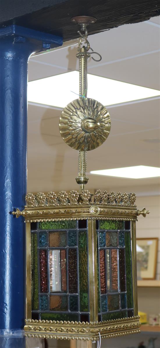 An early 20th century brass and stained glass hall lantern
